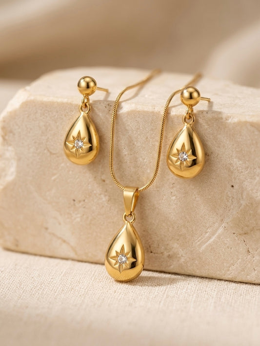 Celestial gold teardrop pendant and earring set.