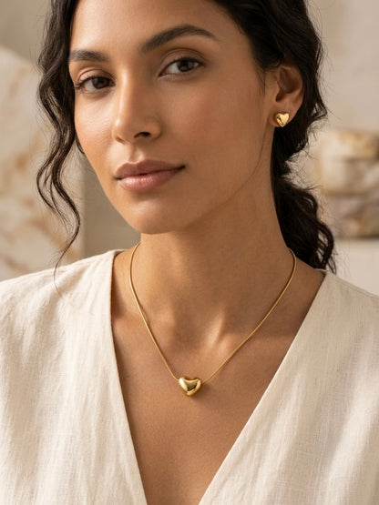 Minimalist gold puffy heart pendant and earrings.