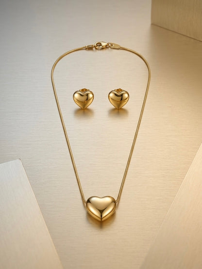 Minimalist gold puffy heart pendant and earrings.