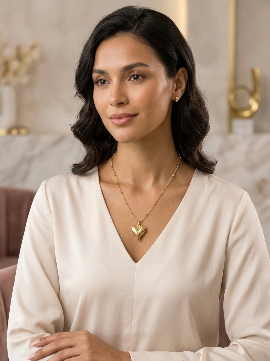 Gold satellite chain puffy heart pendant necklace.
