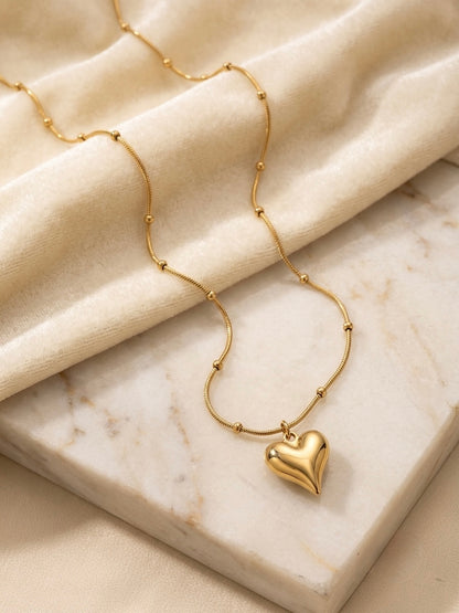 Gold satellite chain puffy heart pendant necklace.