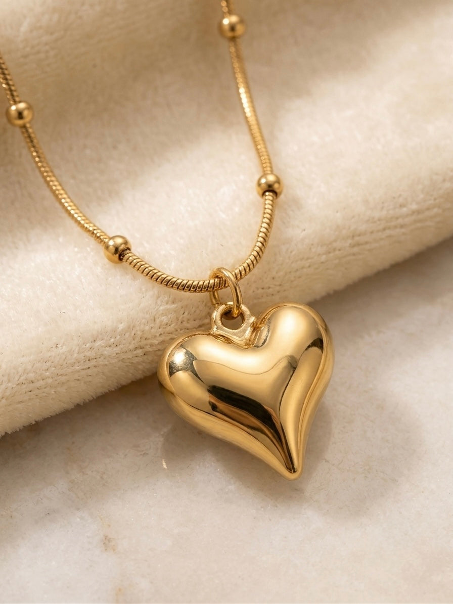Gold satellite chain puffy heart pendant necklace.