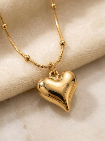 Gold satellite chain puffy heart pendant necklace.