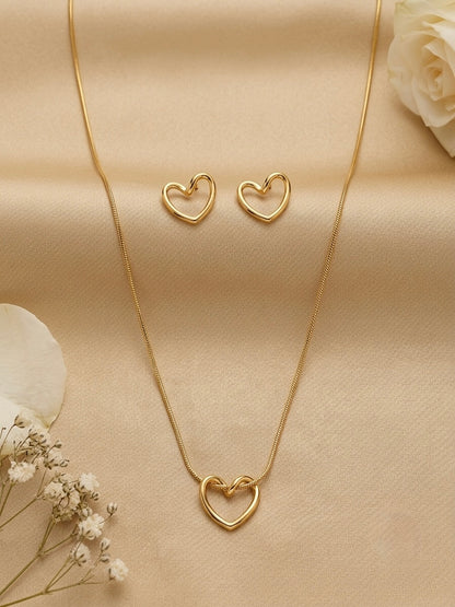 Minimalist hollow gold heart necklace and studs.