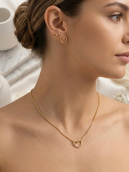 Minimalist hollow gold heart necklace and studs.