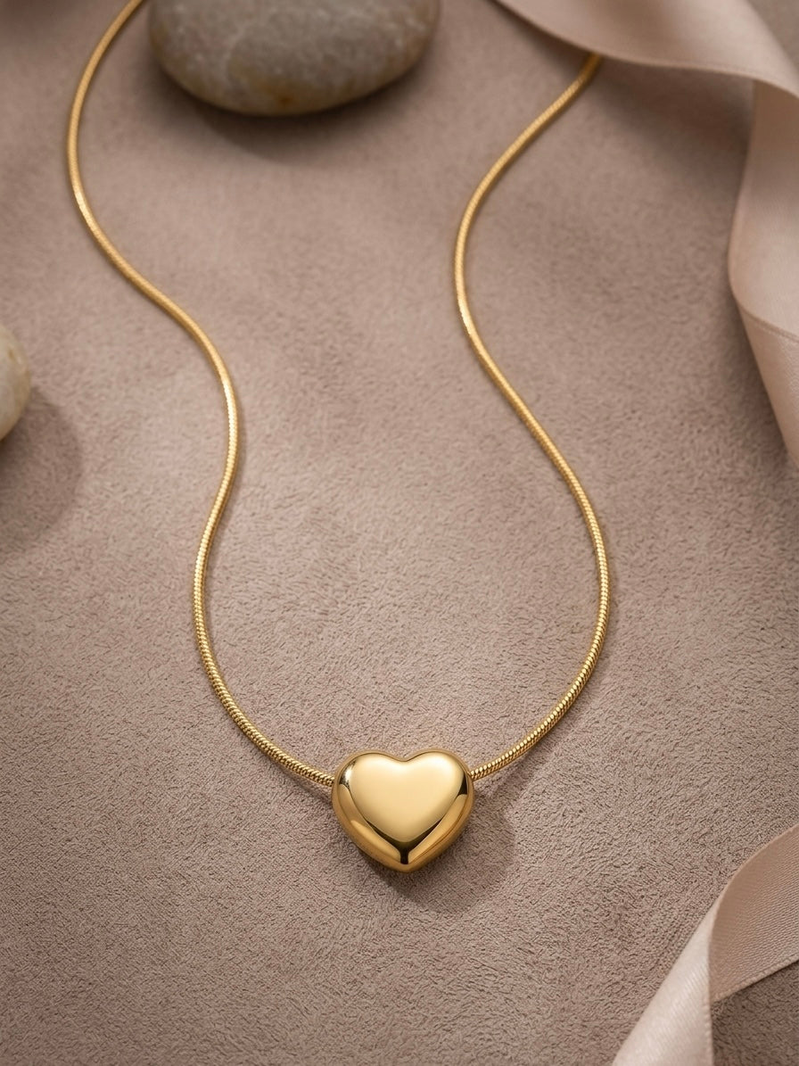Polished gold puffy heart pendant chain necklace.