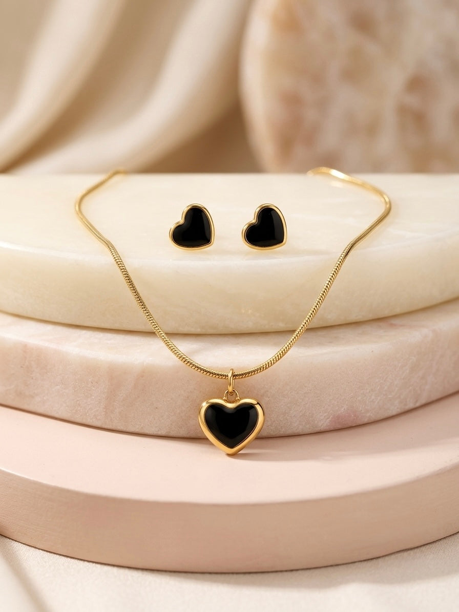 Elegant gold necklace and matching heart earrings.