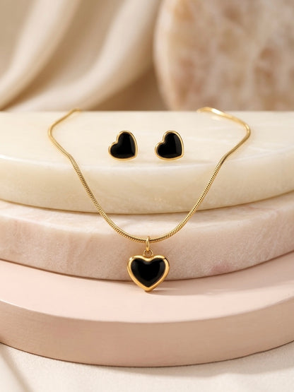 Elegant gold necklace and matching heart earrings.
