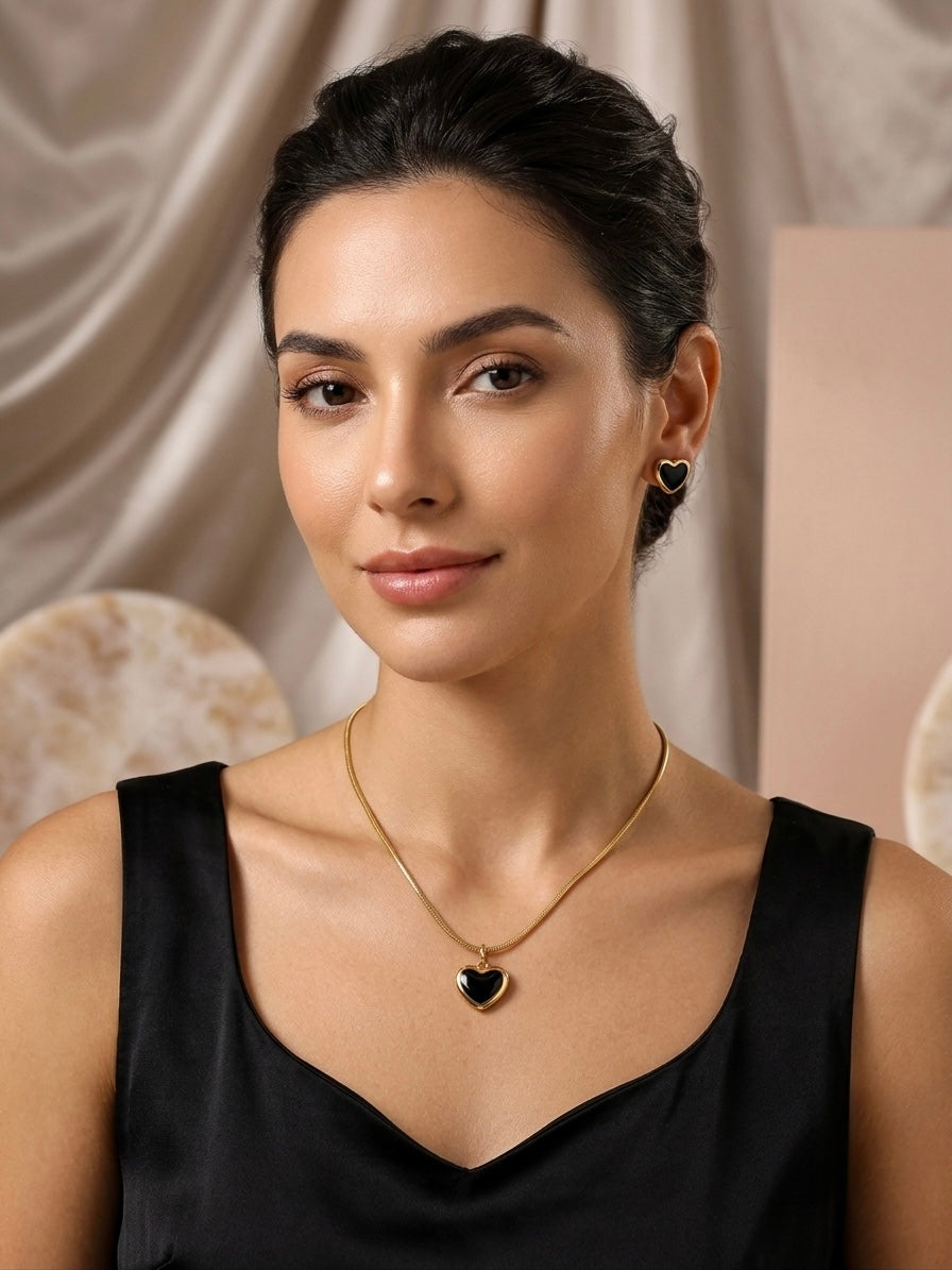 Elegant gold necklace and matching heart earrings.