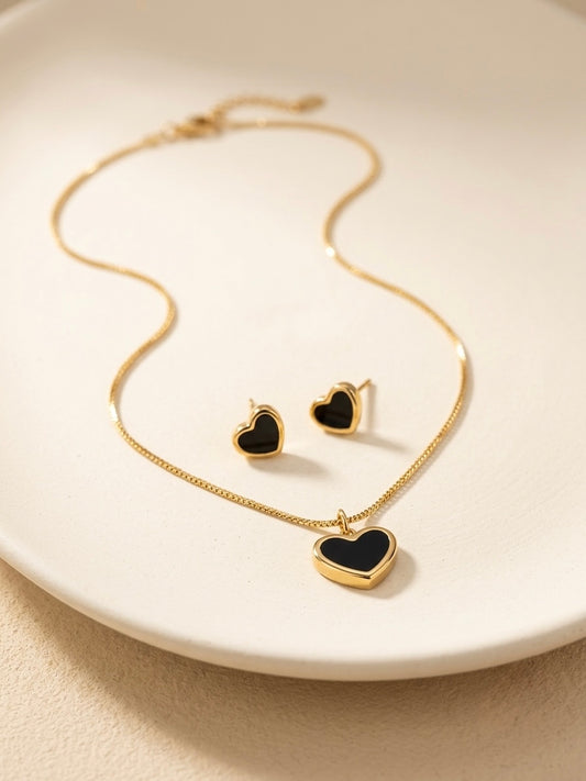 Elegant gold necklace and matching heart earrings.