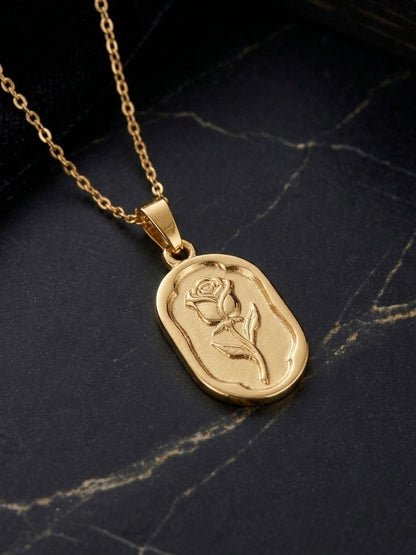 Elegant gold oval rose pendant necklace.