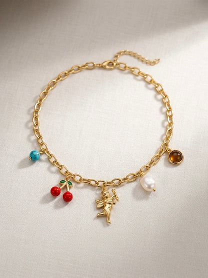 Whimsical multi-charm gold chain necklace.