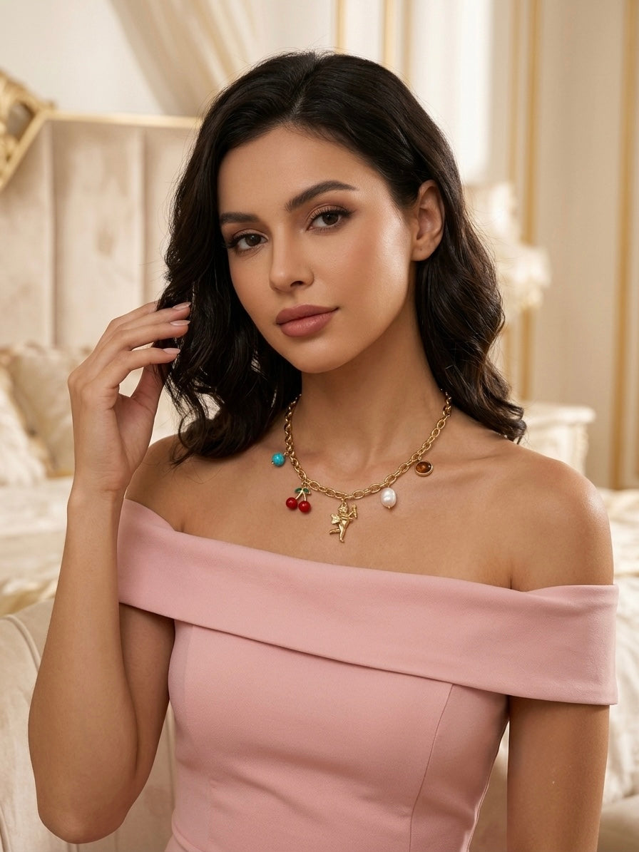 Whimsical multi-charm gold chain necklace.