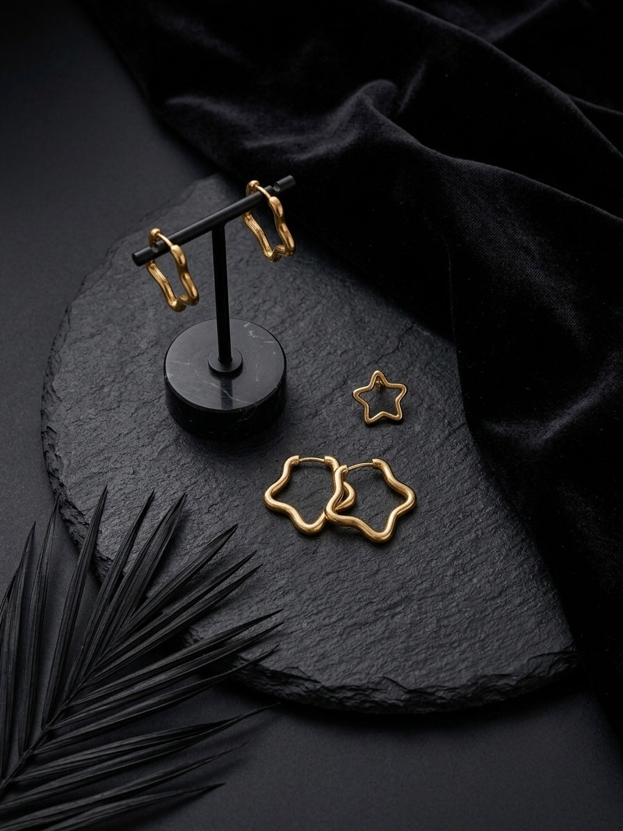 Gold open star hoop earring collection.