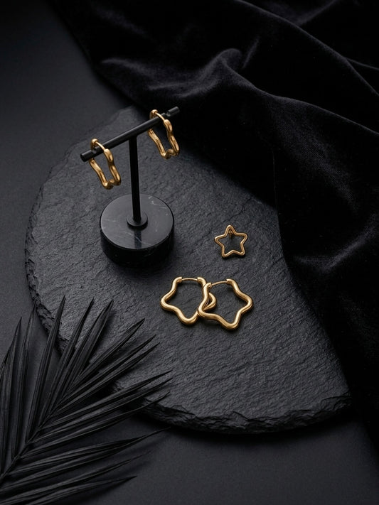 Gold open star hoop earring collection.