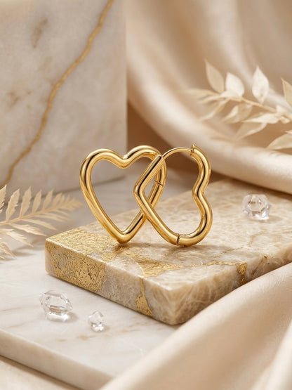 Romantic gold open heart hoop earrings.