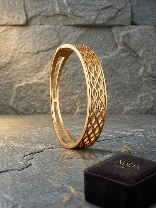Modern interlocking gold geometric bracelet.