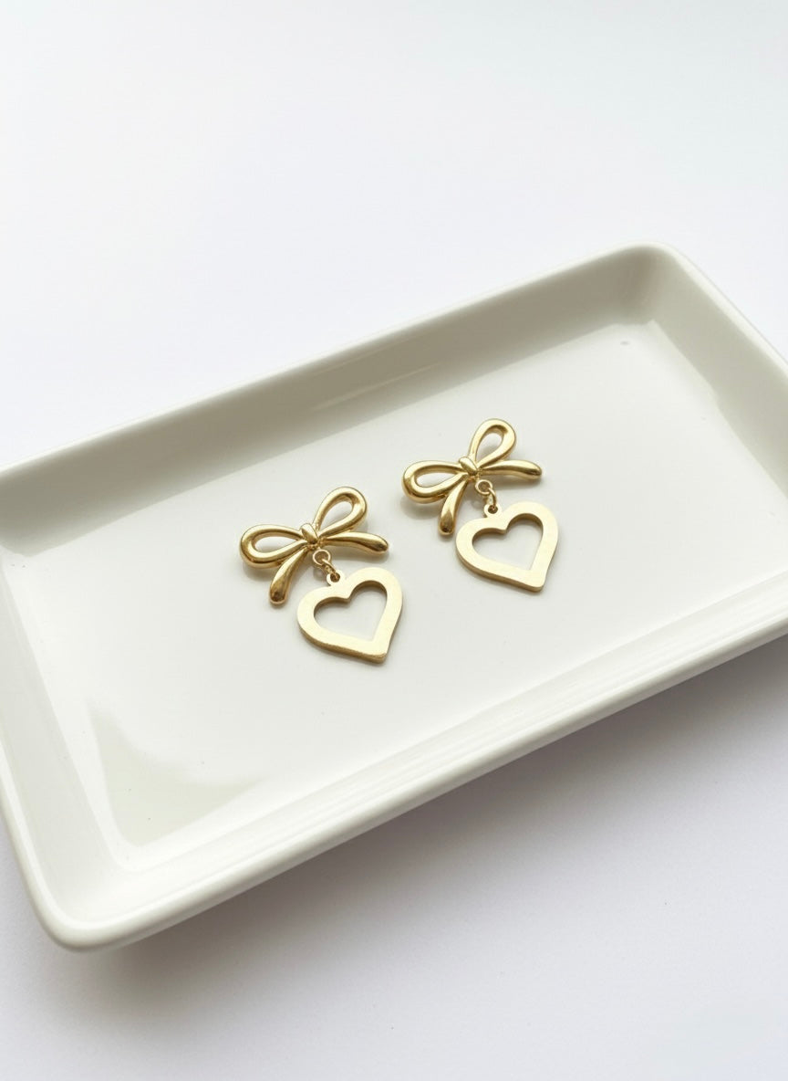 Gold bow heart drop earrings