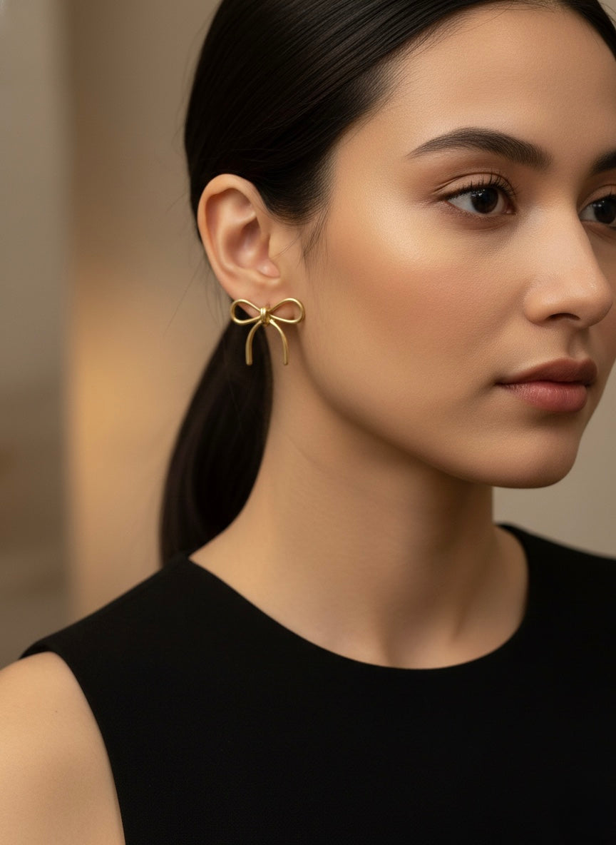 Elegant textured gold bow earrings