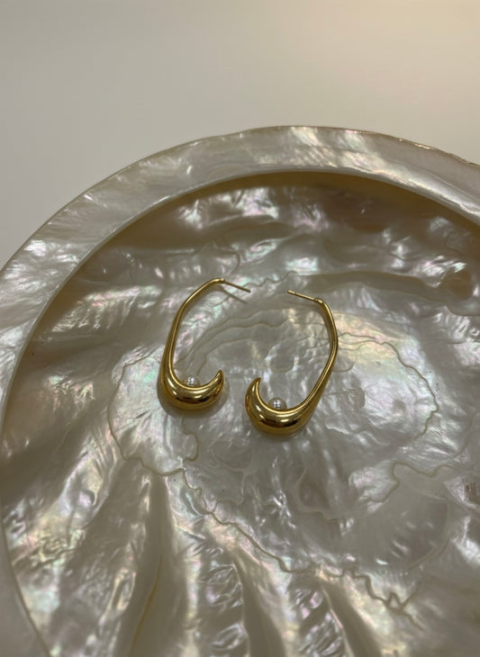 Modern gold crescent hoops with pearls