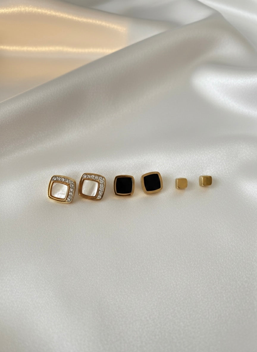 Three pairs different golden stud earrings