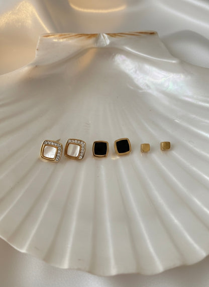 Three pairs different golden stud earrings