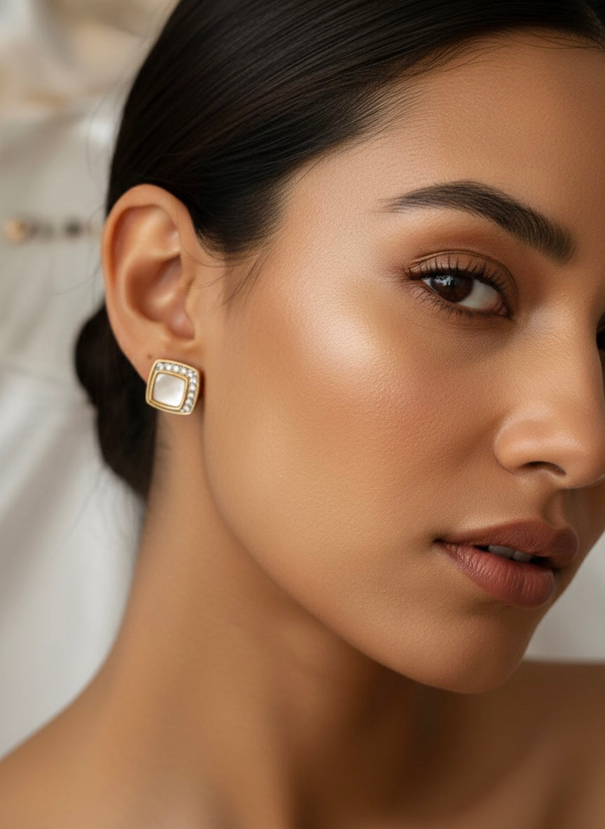 Three pairs different golden stud earrings