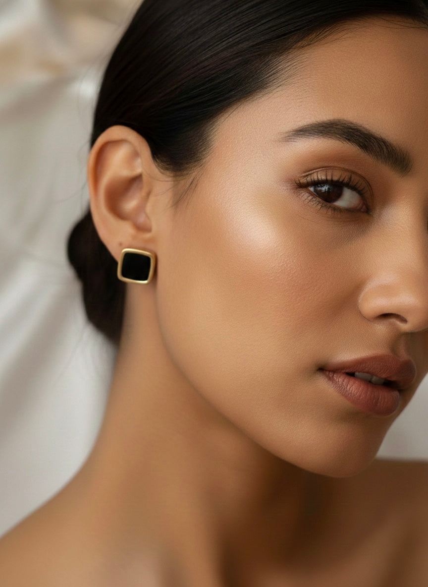 Three pairs different golden stud earrings