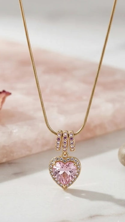 Radiant pink heart, elegant gold necklace.