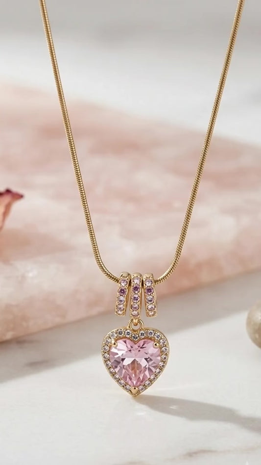 Radiant pink heart, elegant gold necklace.