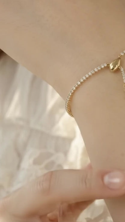 Sleek gold snake adjustable tennis bracelet.